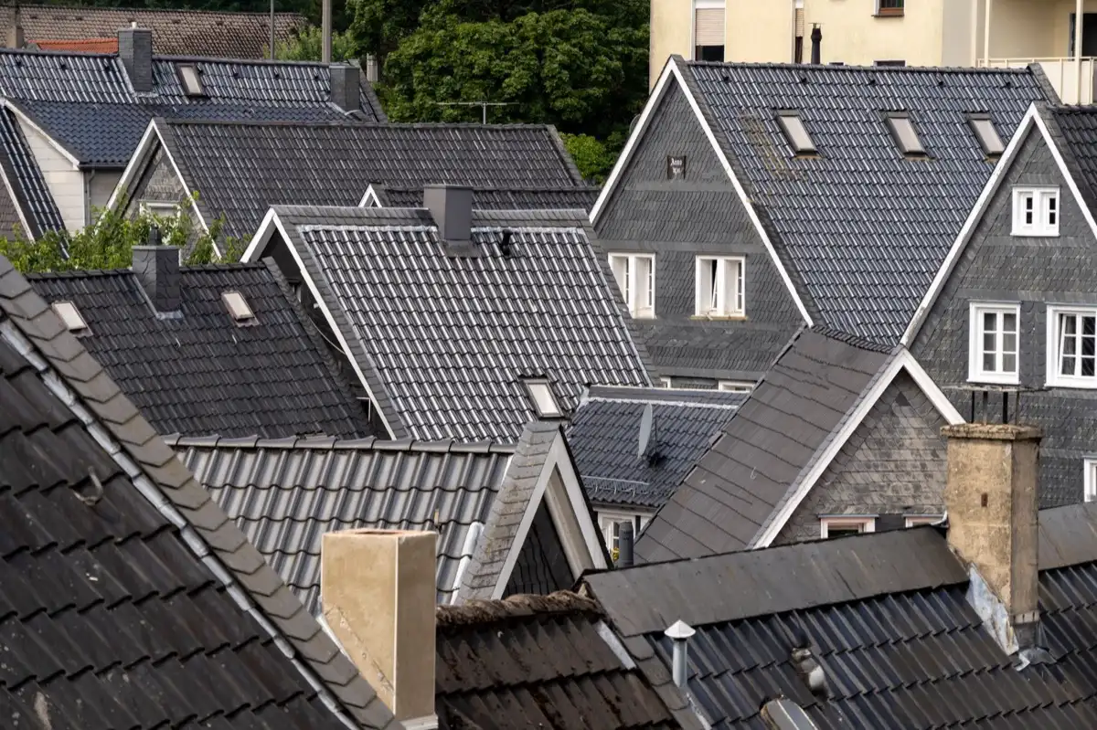 Steep roof eaves and gutter lines on houses in Brownsville, TX