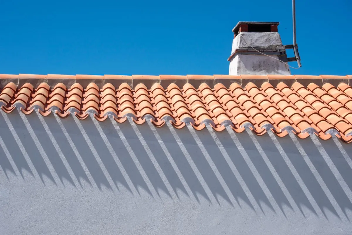 Roof ridge line and chimney on a home in Brownsville, TX